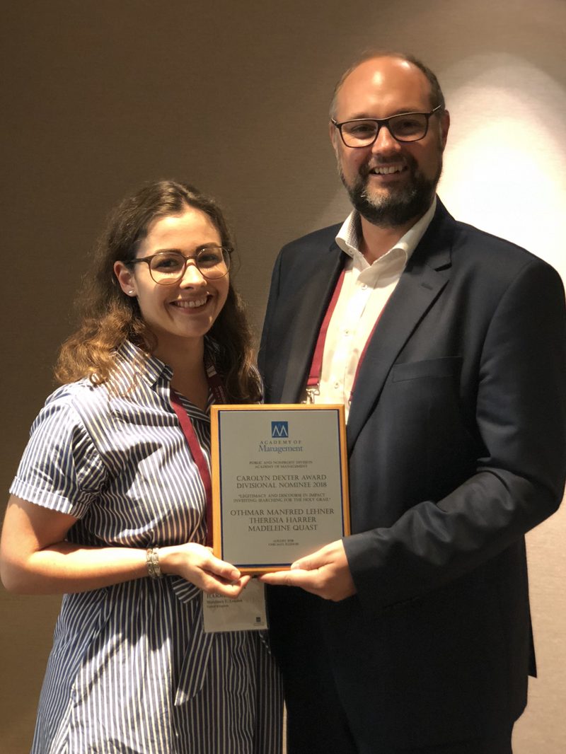 Othmar M. Lehner and Theresa Harrer holding the Academy of Management award certificate